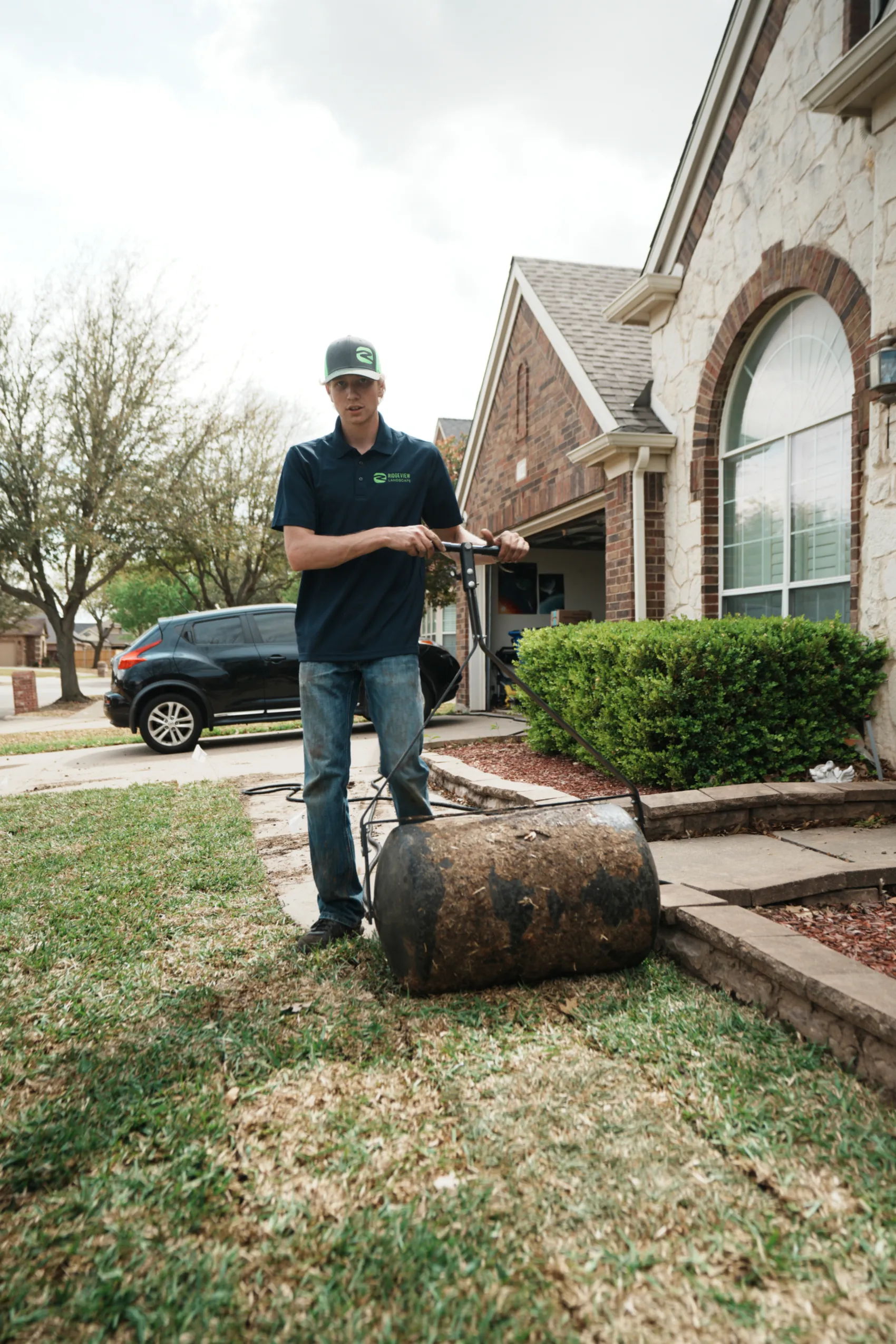 Residential sod installation in Mansfield, TX with sod being unrolled