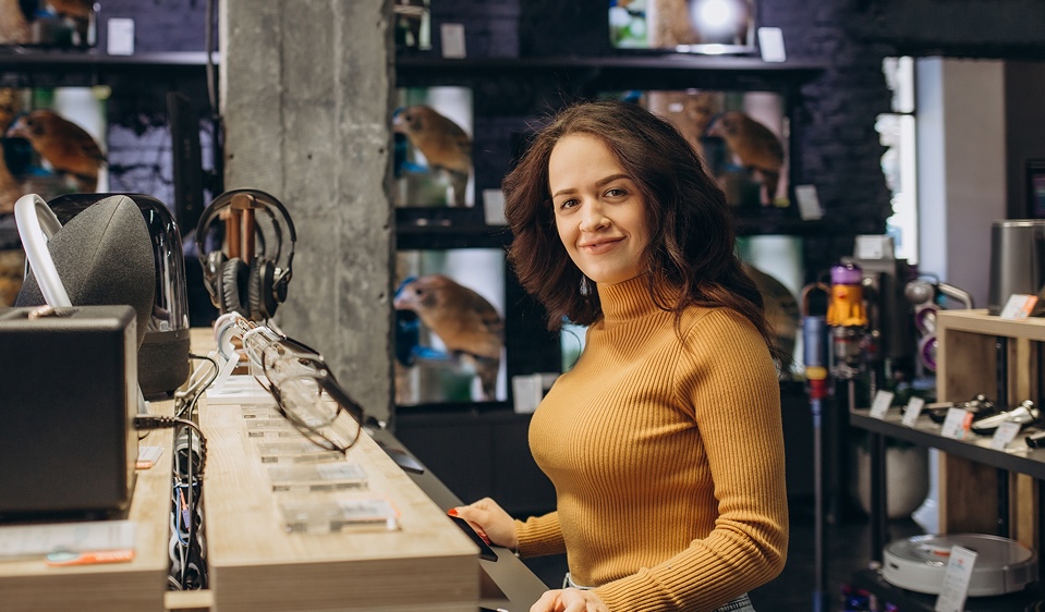 Woman looking at tech products in a store