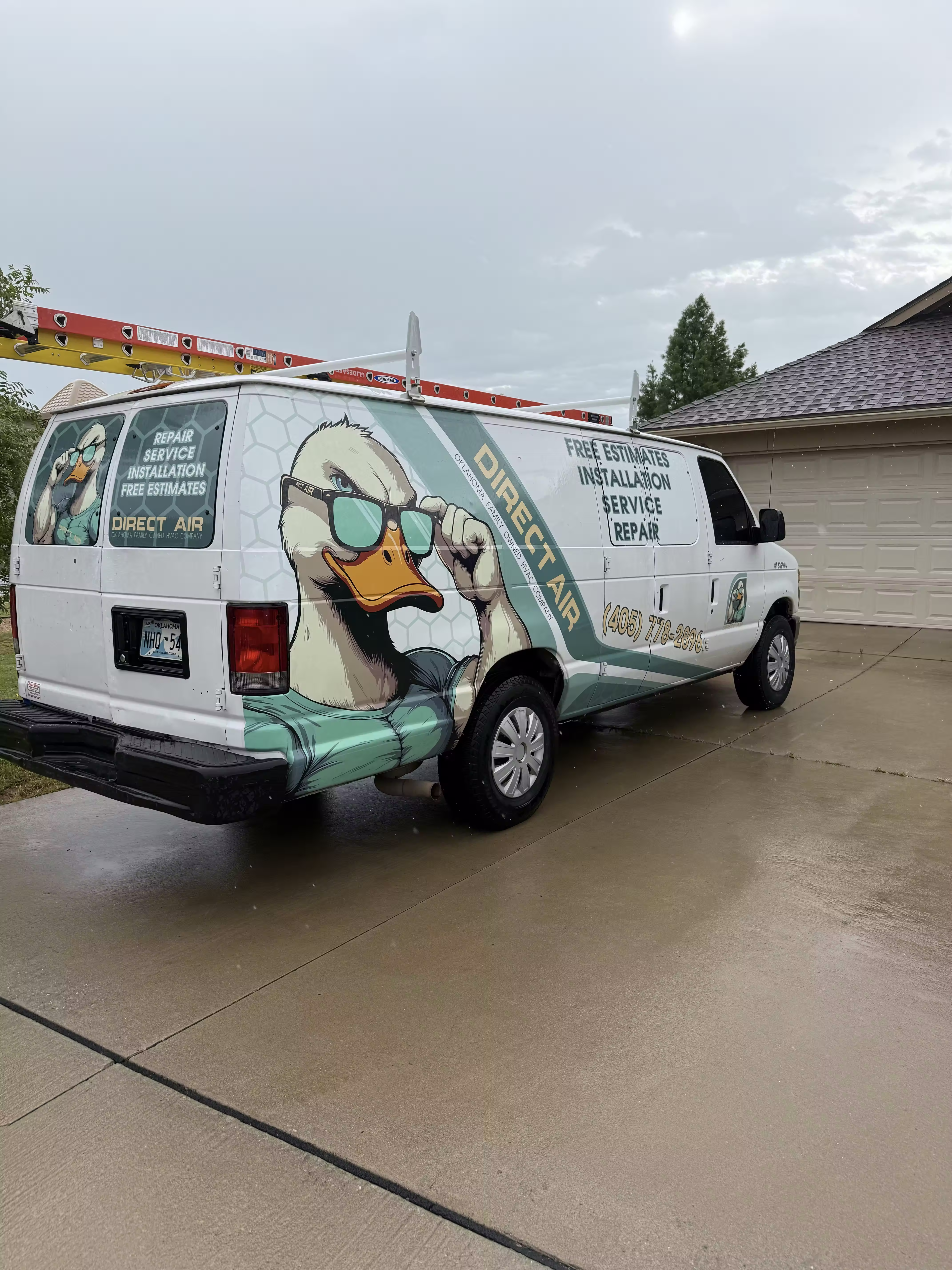 Cool duck mascot on Direct Air service van with roof rack