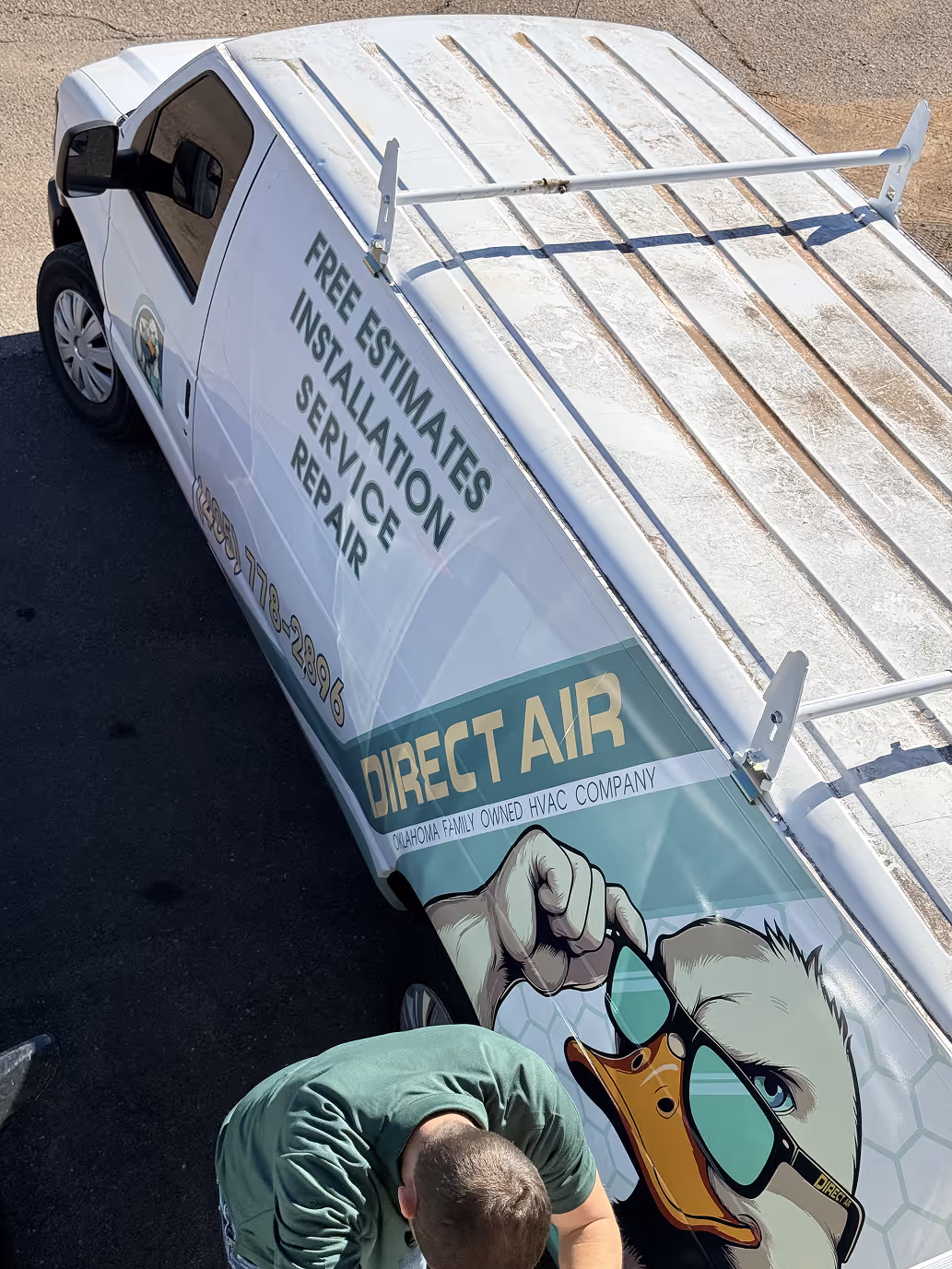 White Direct Air van with eagle logo offering free installation service repair