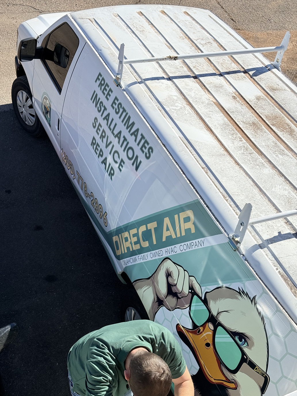White Direct Air van with eagle logo offering free installation service repair