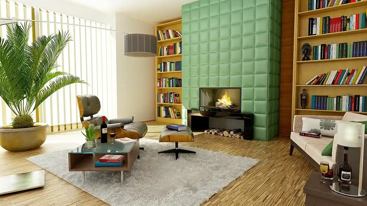 Modern living room with green tiled fireplace, bookshelves, and designer chair