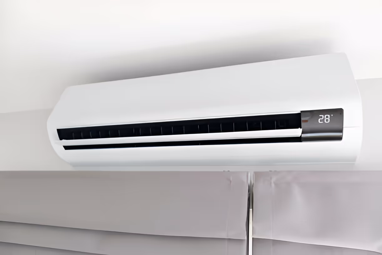 White wall-mounted air conditioner with digital display set to 28 degrees