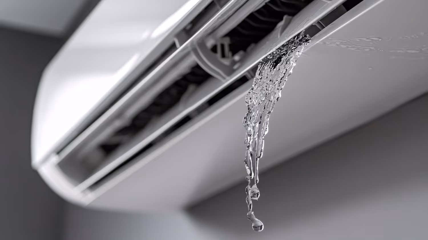 Air conditioner dripping water in black and white close-up