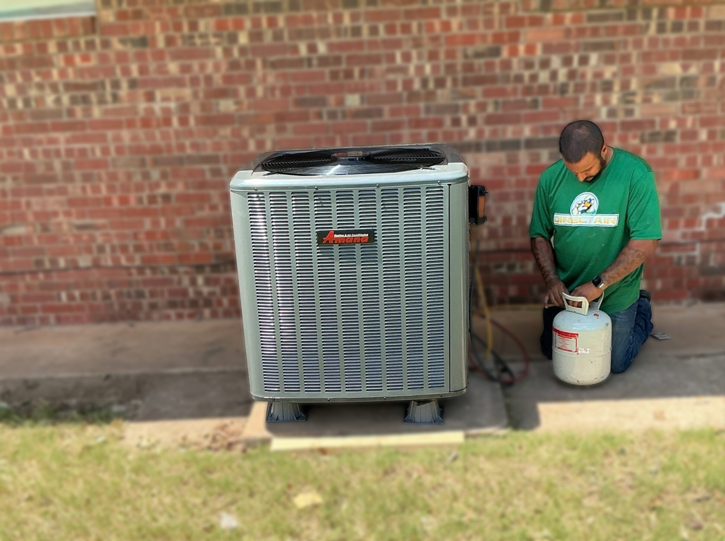 Direct Air technician checking the outdoor disconnect on an AC unit in Oklahoma City