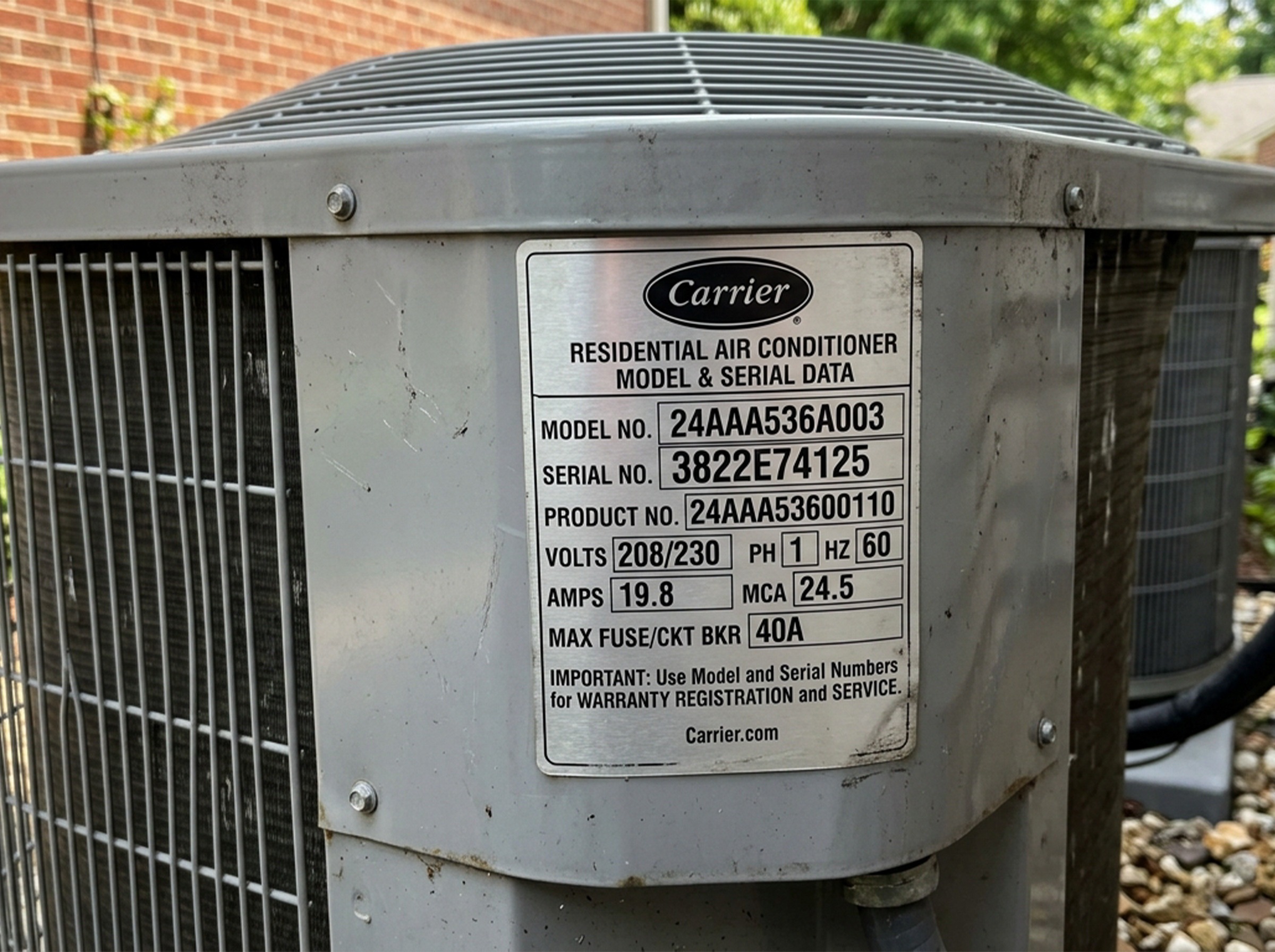 Model and serial plate on a residential AC unit used for warranty registration in Oklahoma City