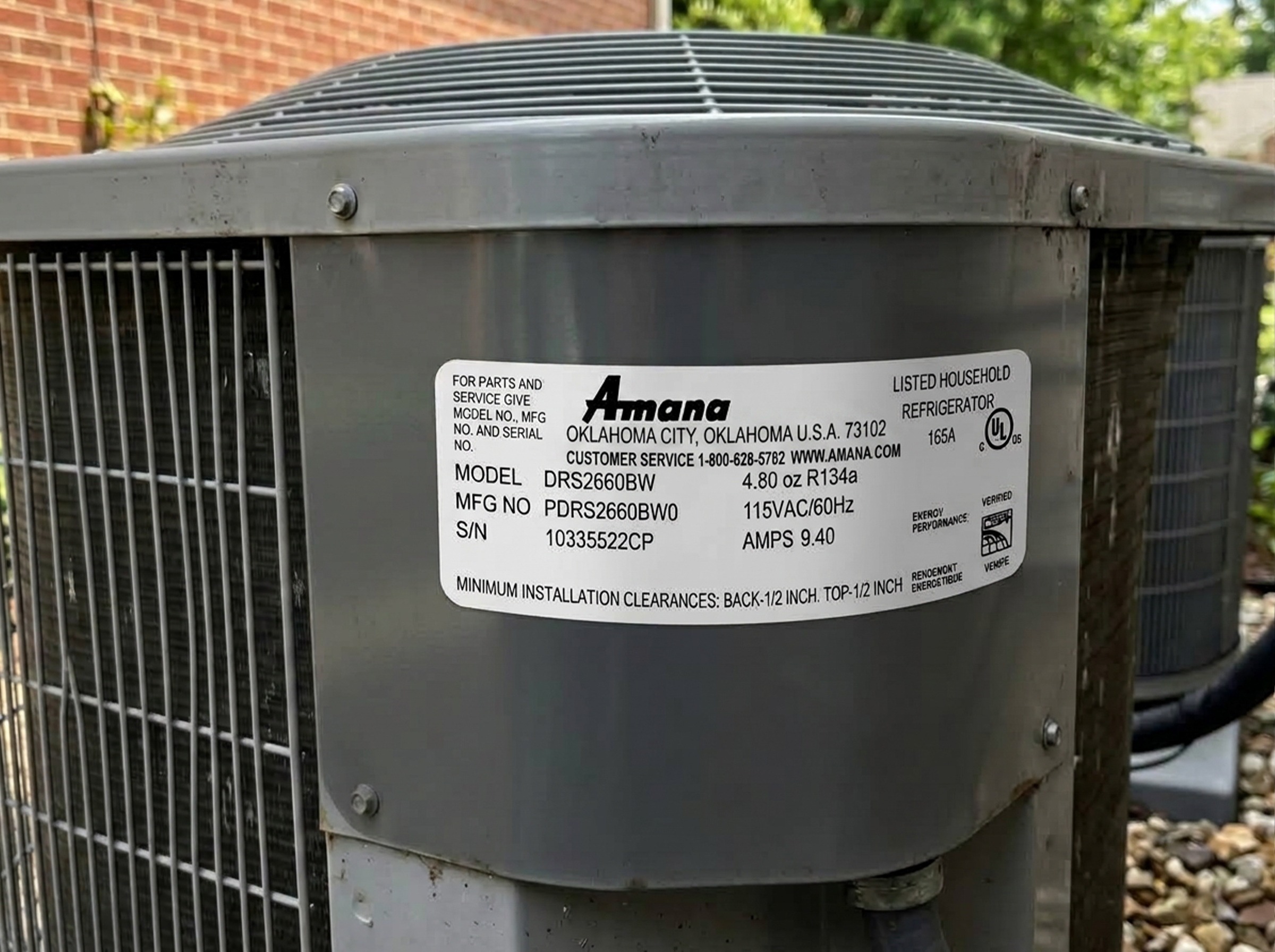 Model and serial plate on a residential AC unit used for warranty registration in Oklahoma City