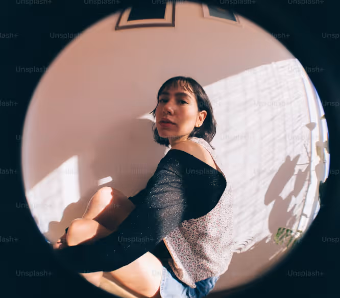 Creative portrait of a woman captured through a fisheye lens, reflecting artistic self-expression and personal branding for Instagram with Kicksti.