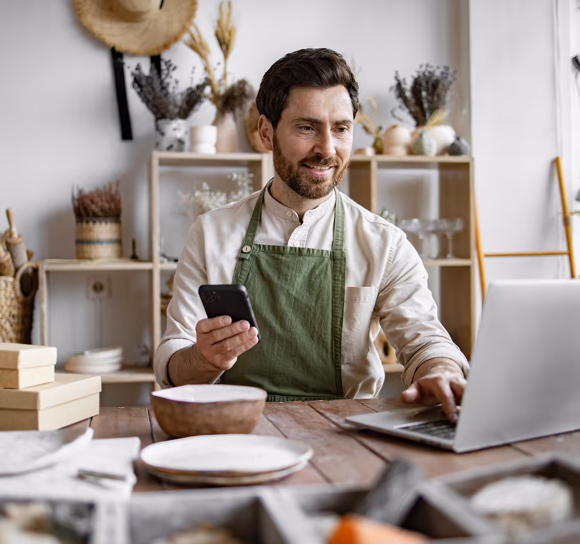 Small business owner managing his brand online, highlighting how Kicksti helps entrepreneurs increase visibility and engagement.