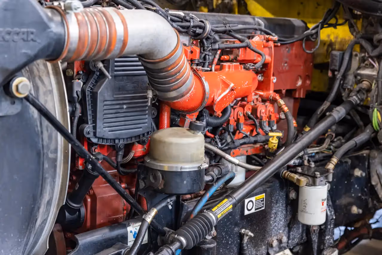 No start diagnostic on a diesel engine showing intake, fuel lines, and electrical harnesses under inspection. 