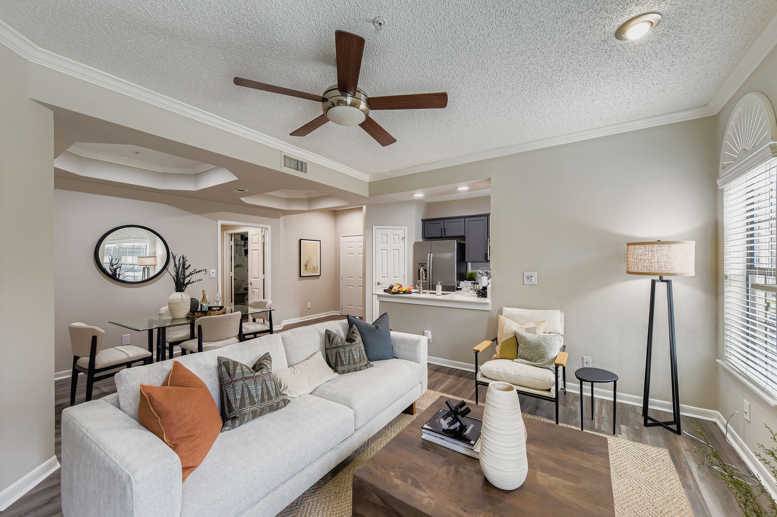 Living room with ceiling fan and sofa