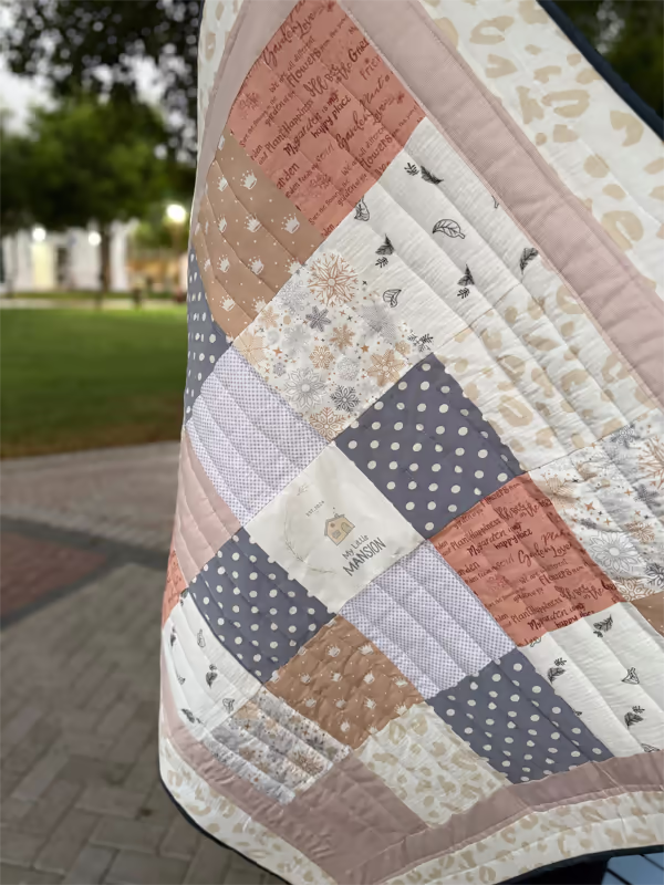 Patchwork baby quilt for tummy time or stroller, neutral nursery tones, handmade cotton, UAE brand My Little Mansion.