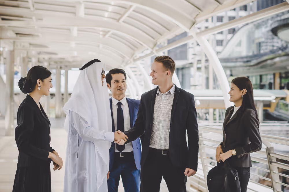 Managers greet client from middle east