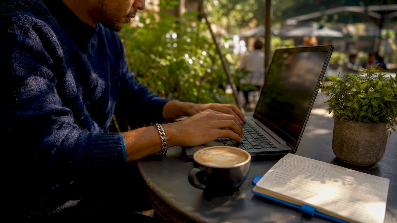 Hands completing on-time business credit payment online