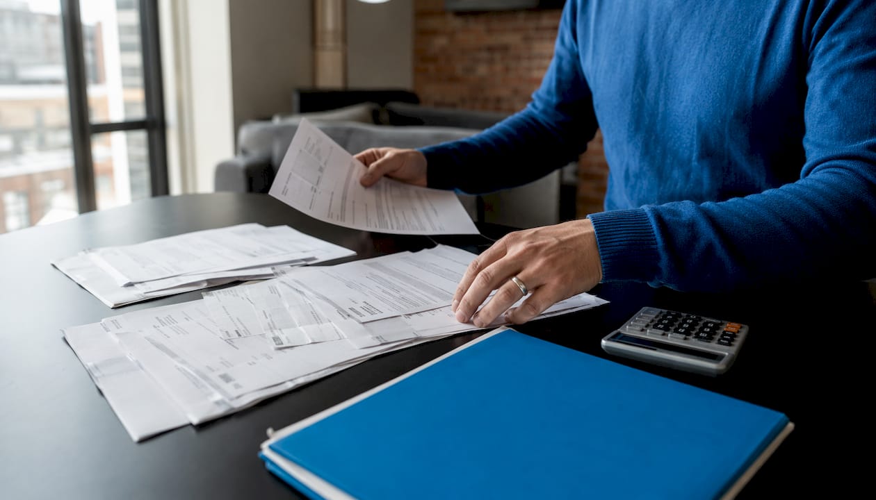 Hands organizing business financial documents