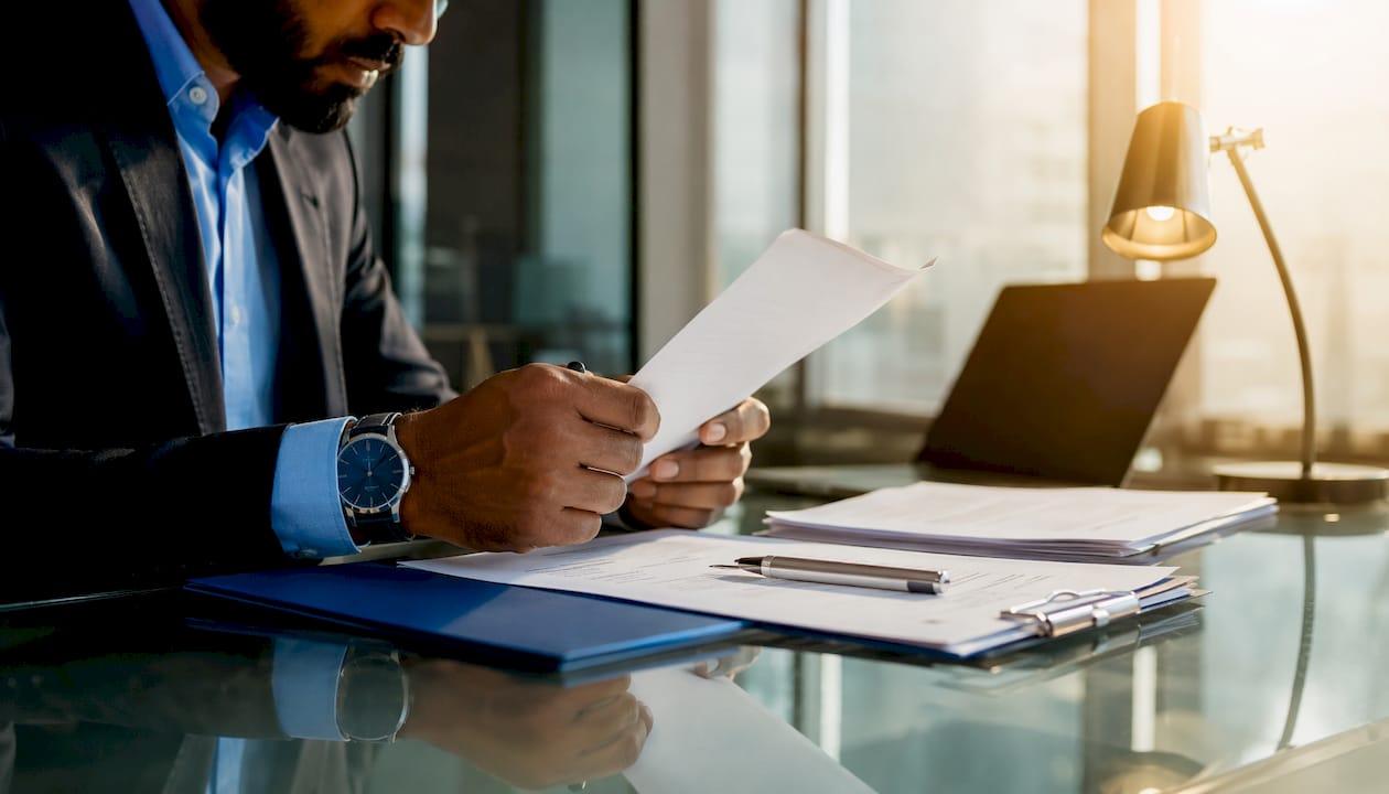 Hands signing business loan document