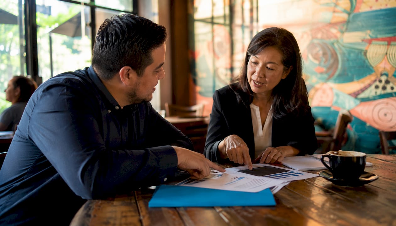 Two people discussing business loan types