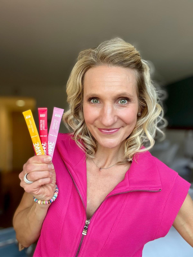 A person holding three sticksAI-generated content may be incorrect.