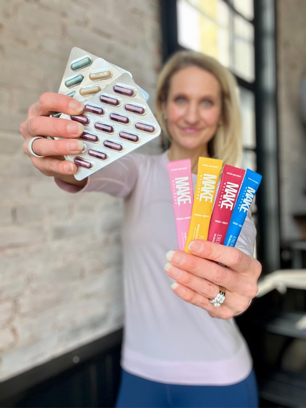 A person holding a pack of pillsAI-generated content may be incorrect.