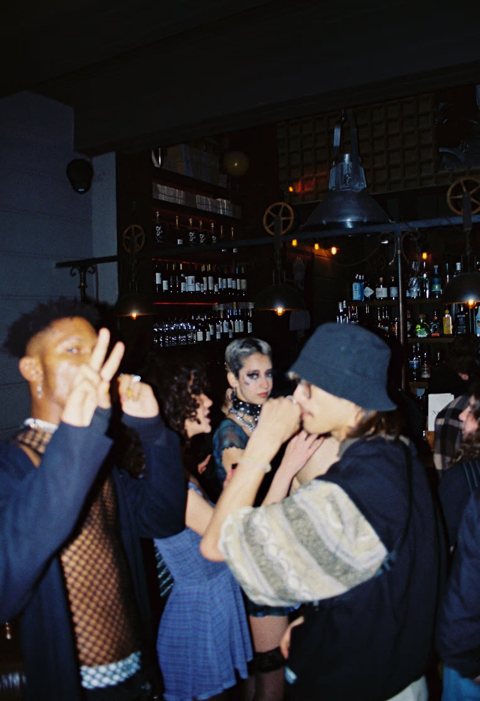 A group of people in a modern outfit posing at the Soirée's launch party in London, UK