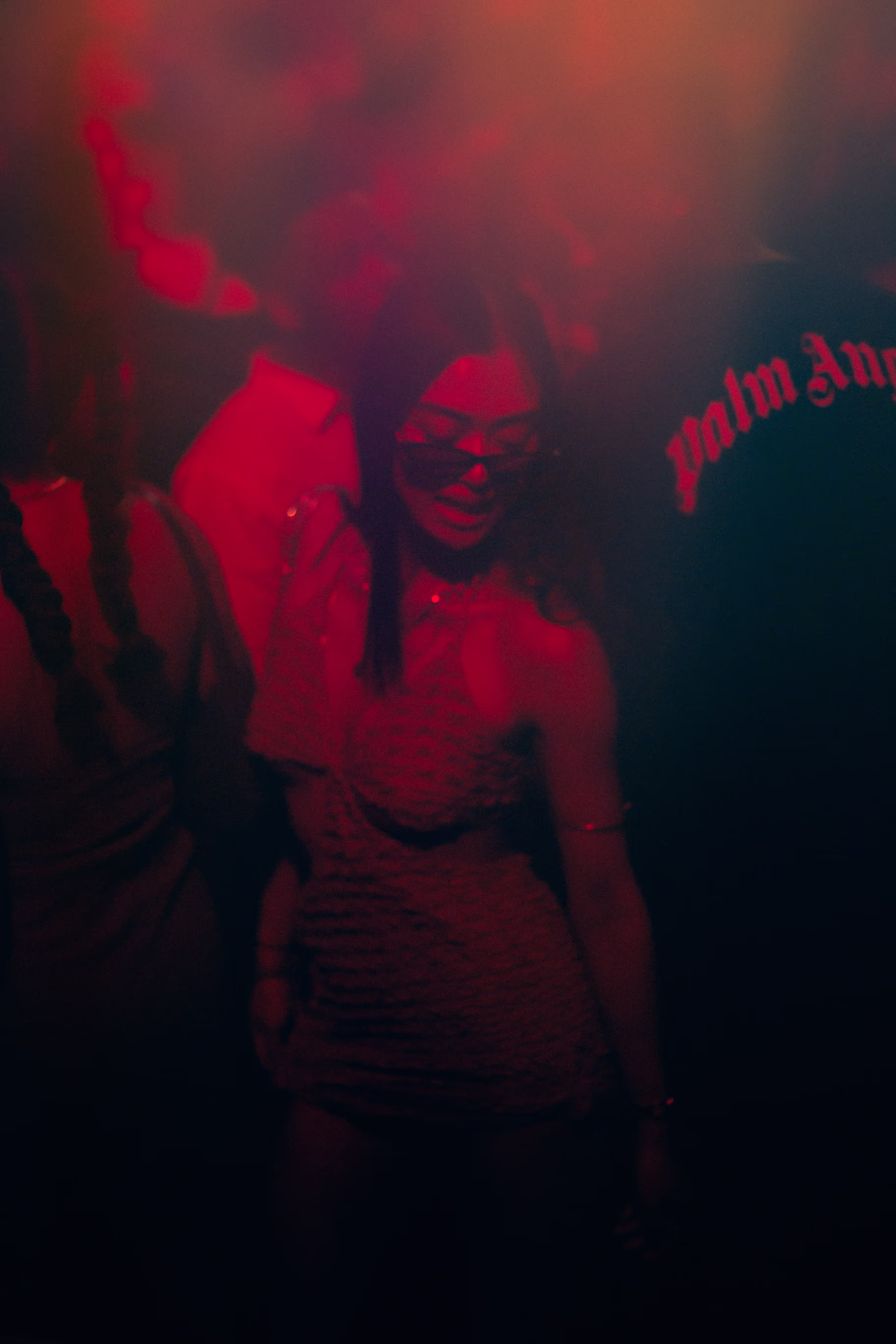 A young woman in dress dancing at Soirée's "Red Room" party at Proud Cabaret in Brighton, UK
