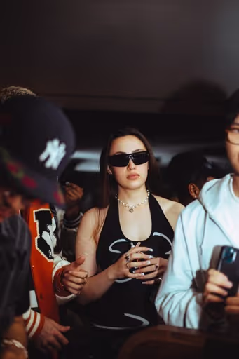 A young woman in a modern outfit chills at Soirée's collaboration party with Brighton Beach House in Brighton, UK