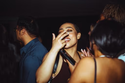 A group of young people dancing at Soirée's collaboration party with Brighton Beach House in Brighton, UK
