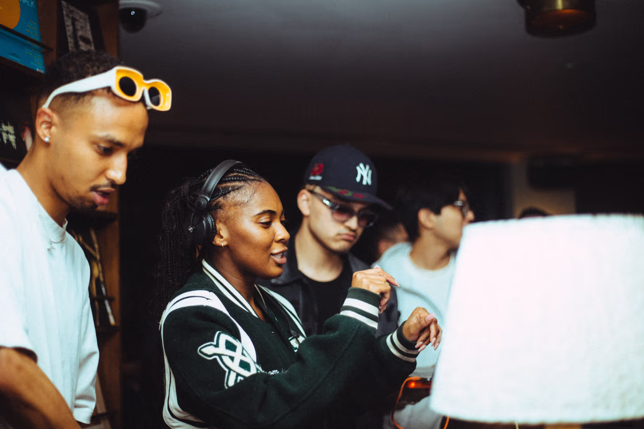 Three DJs have fun at the DJ deck at Soirée's collaboration party with Brighton Beach House in Brighton, UK