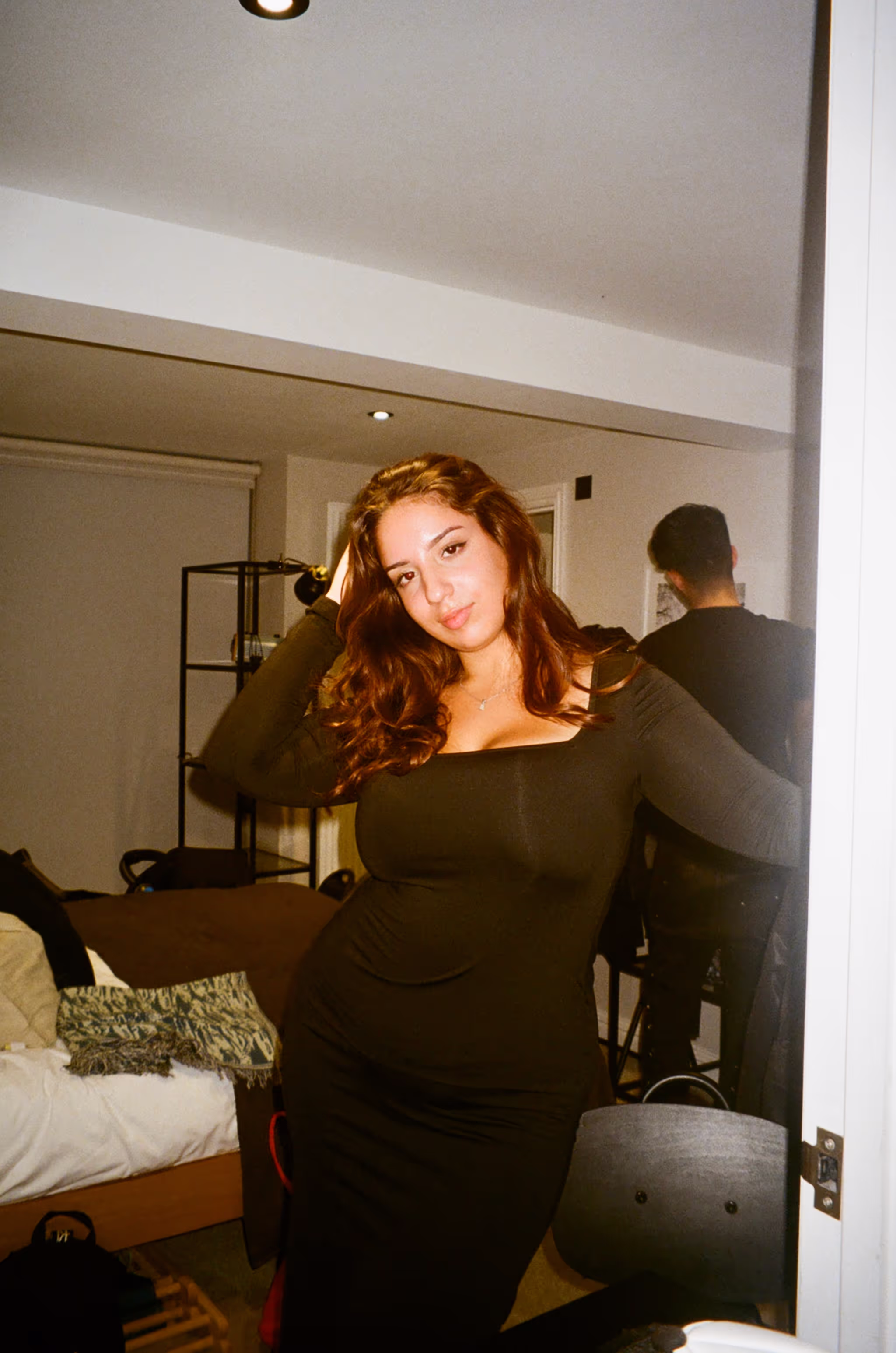 A young woman posing at Soirée's MONOCHROME House Party vol.2, with a dress code ALL BLACK