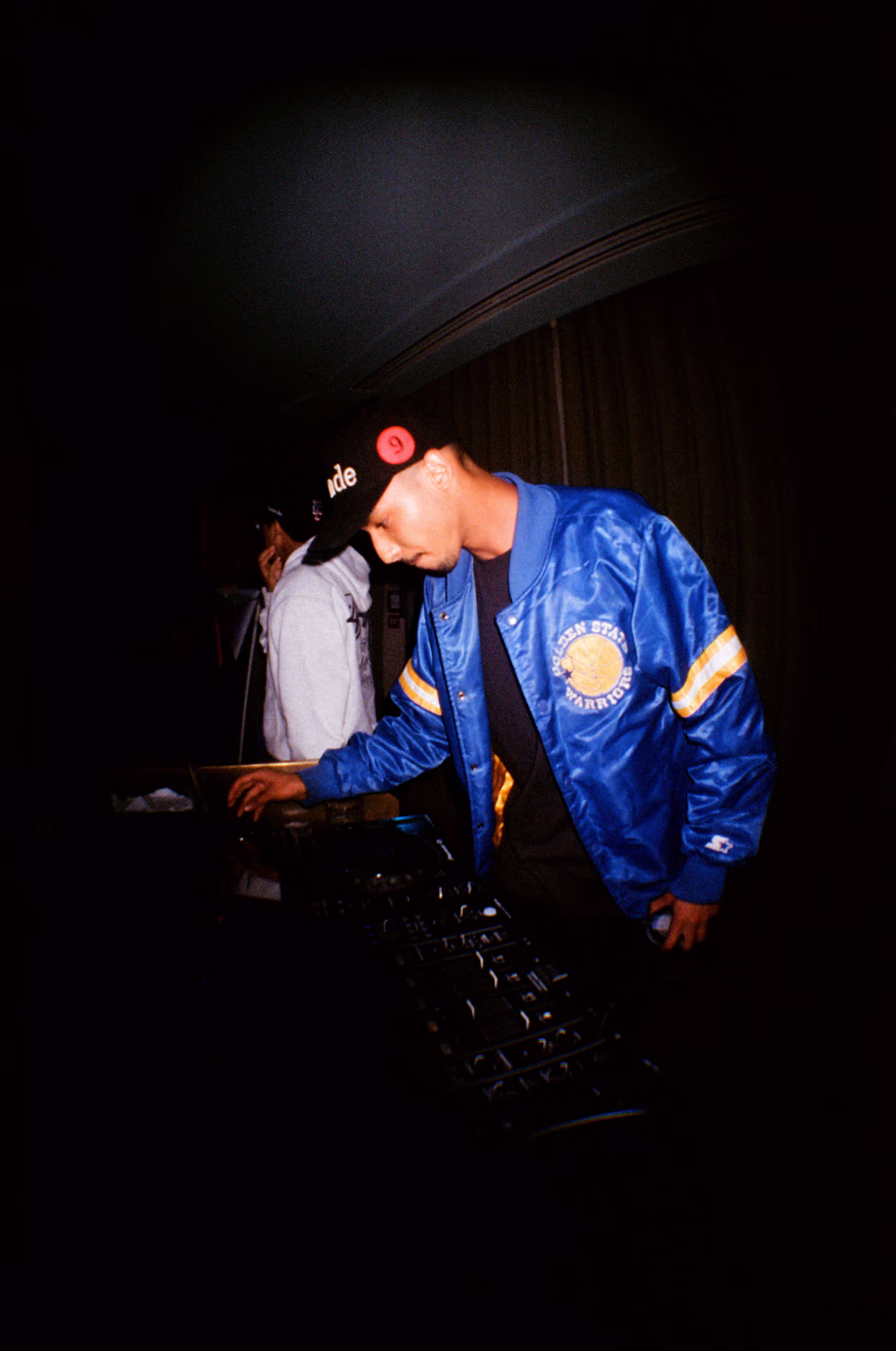 A DJ performing at the Soirée art show and music event at Soho Brighton Beach House, Brighton, UK