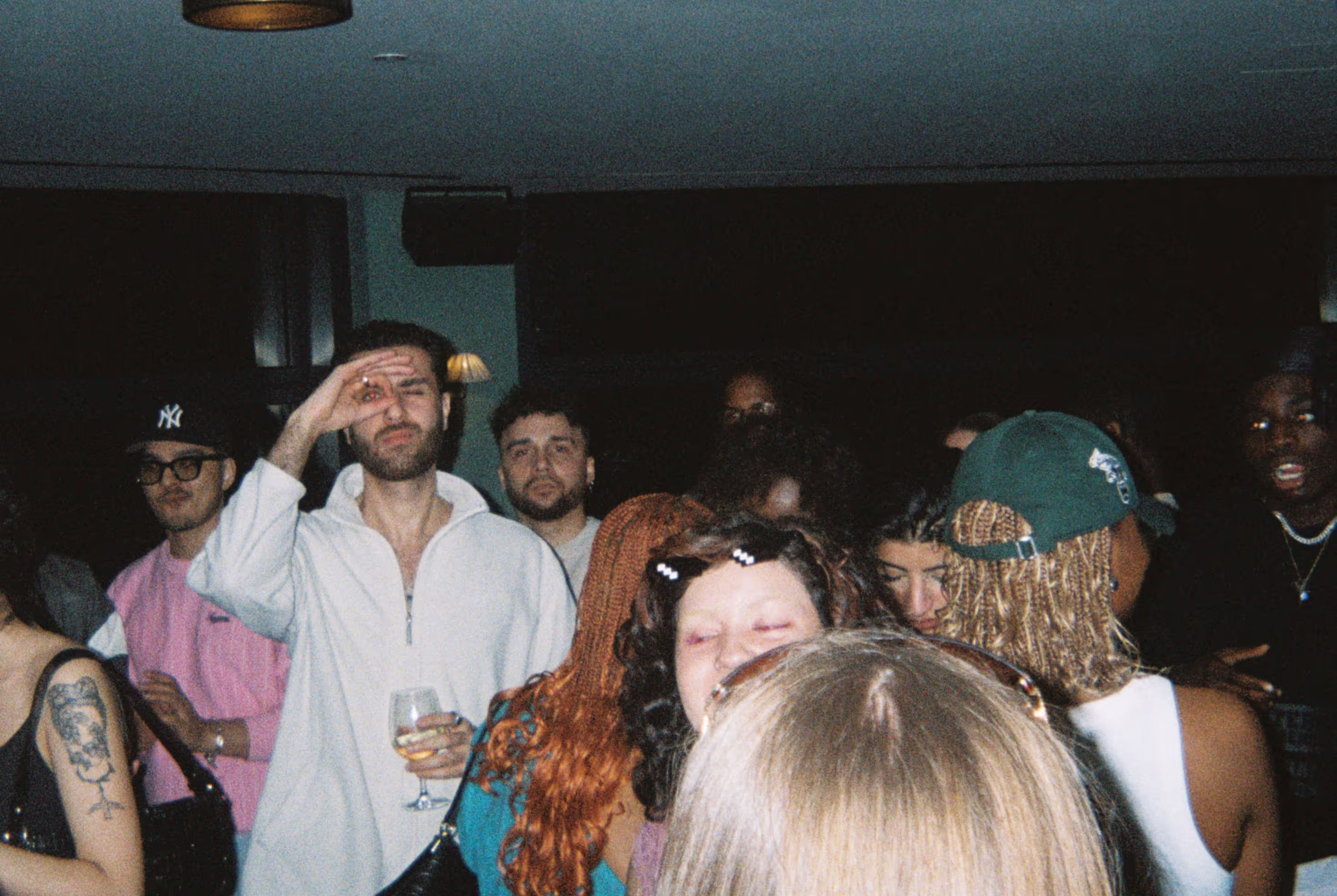 A crowd having fun and posing for the photo at the Soirée's event in Brighton, UK