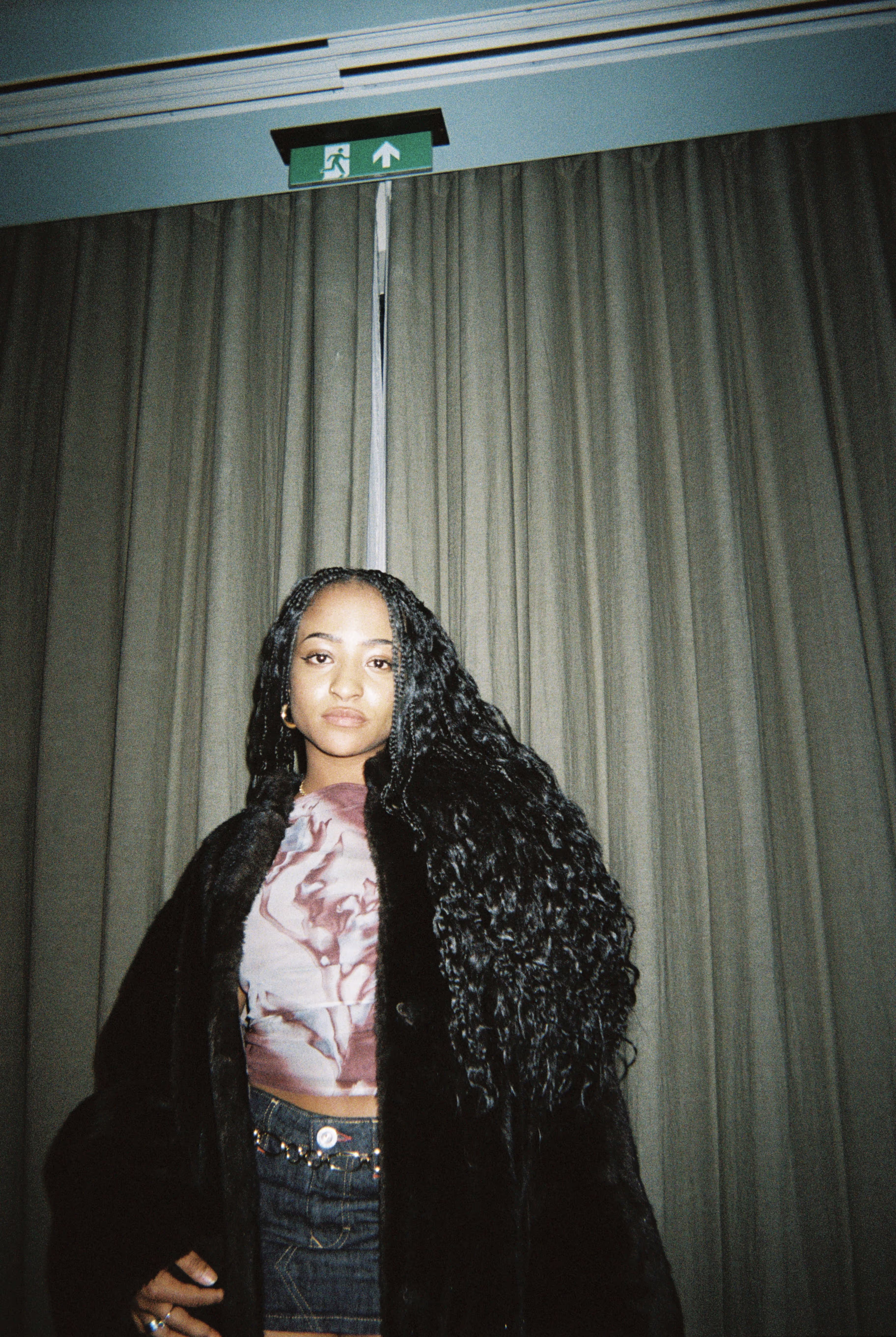 A young woman in a modern outfit posing at the Soirée's event in Brighton, UK