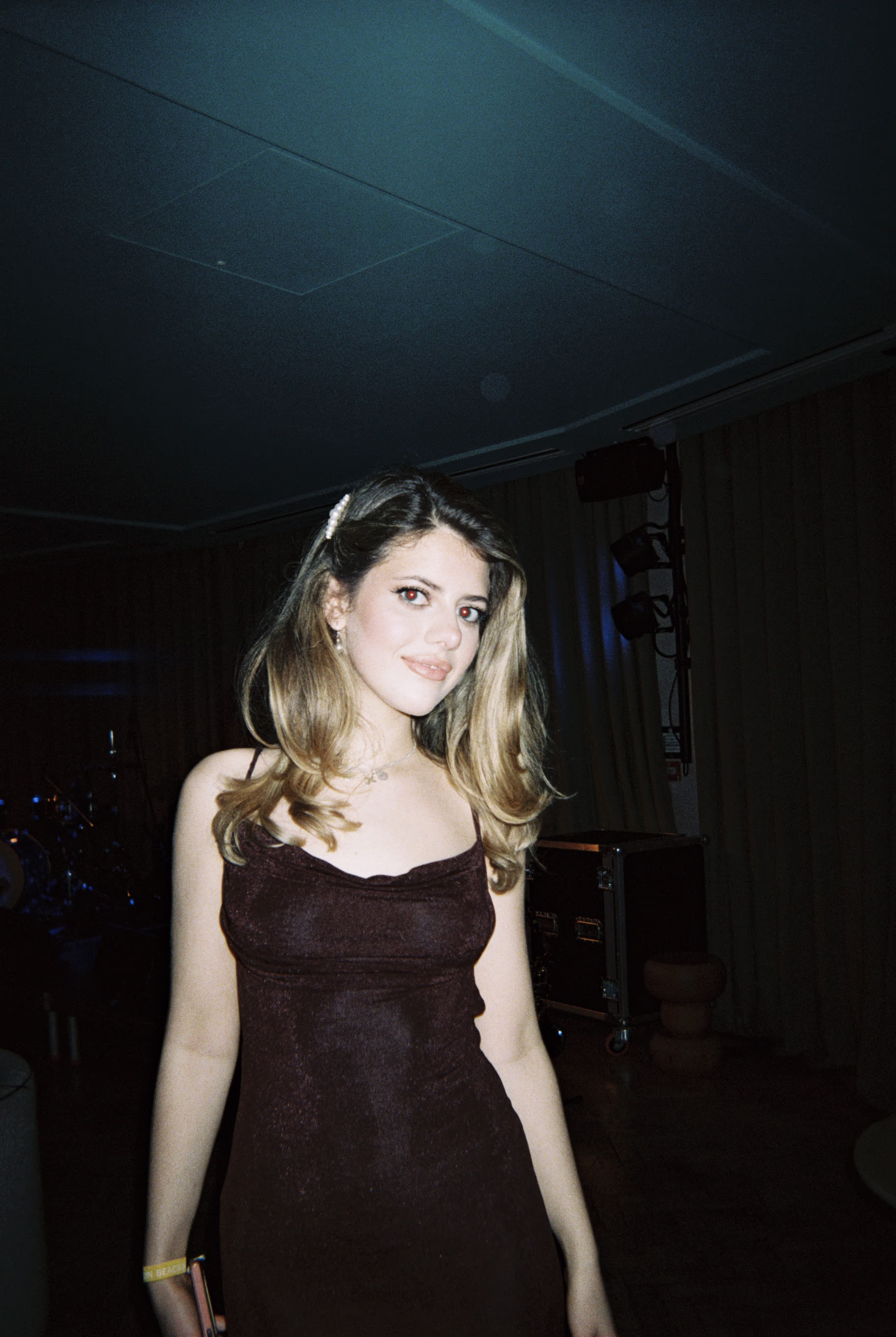 A young woman in a dress, posing at the Soirée's event in Brighton, UK