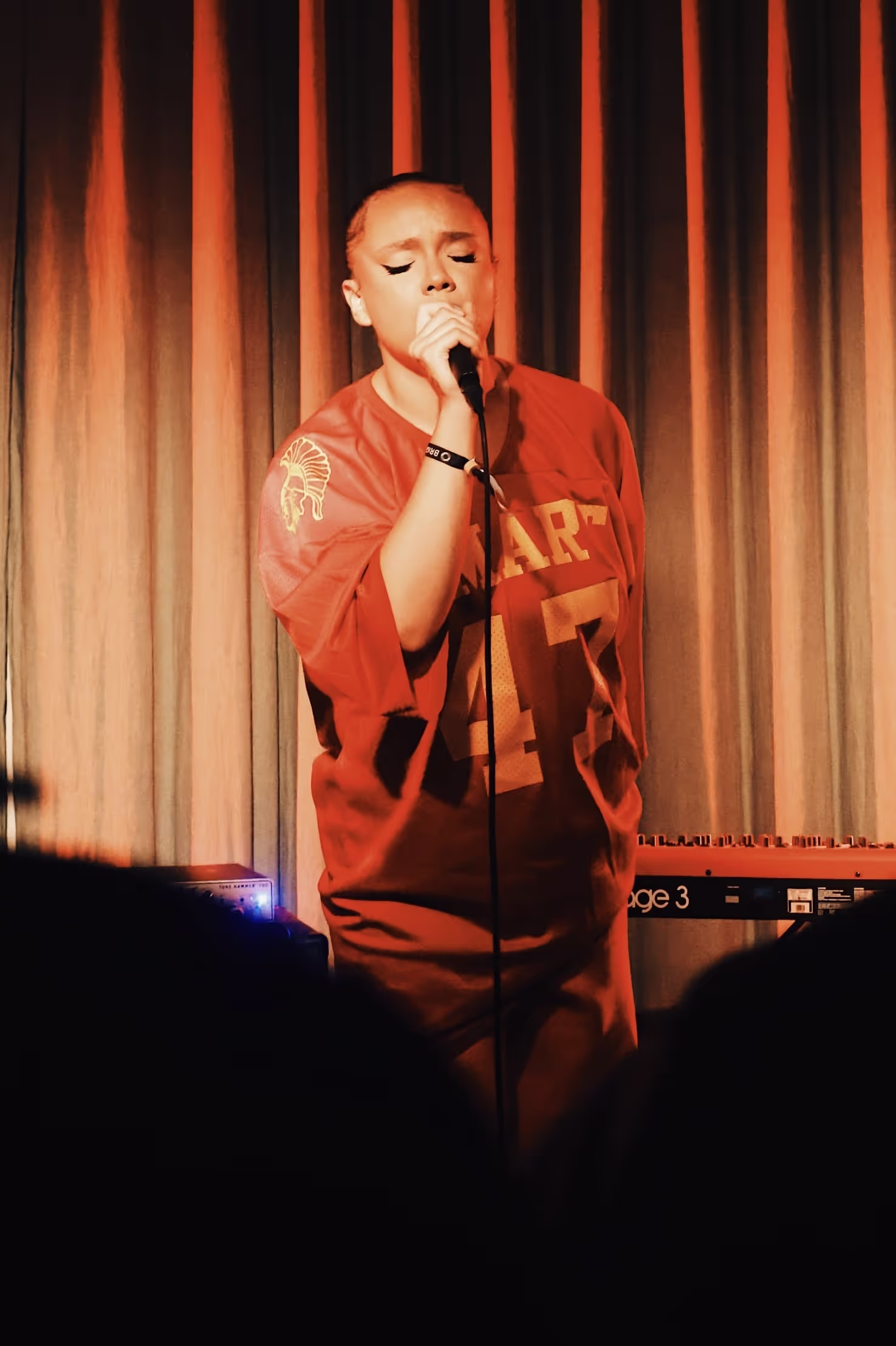 A young singer performing at the Soirée & GRADUATION RECORDS collaboration event at Beach House, Brighton, UK