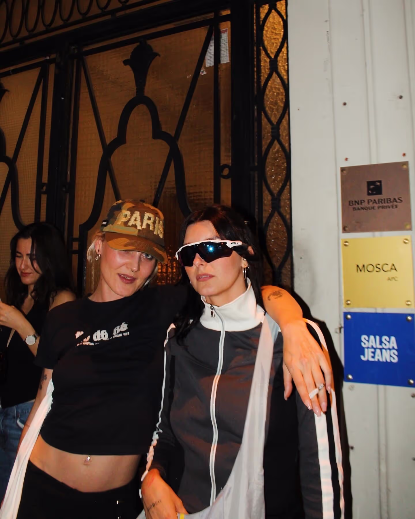 Two women posing at a Soirée's party at Paris Fashion Week 2024