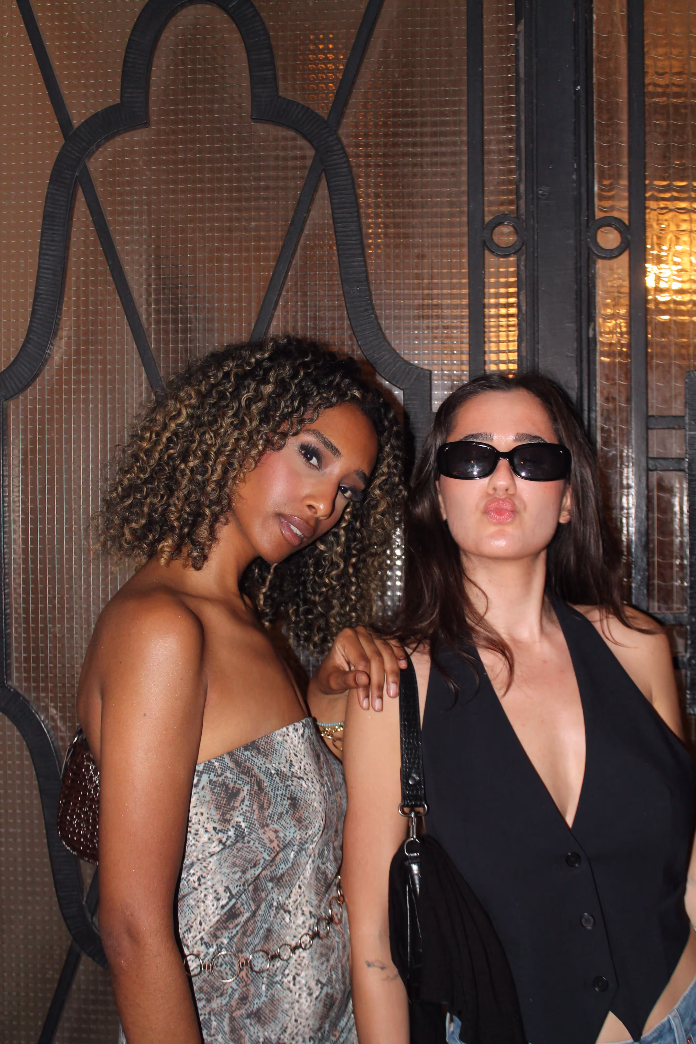 Two young women posing outside the Soirée's party at Paris Fashion Week 2024