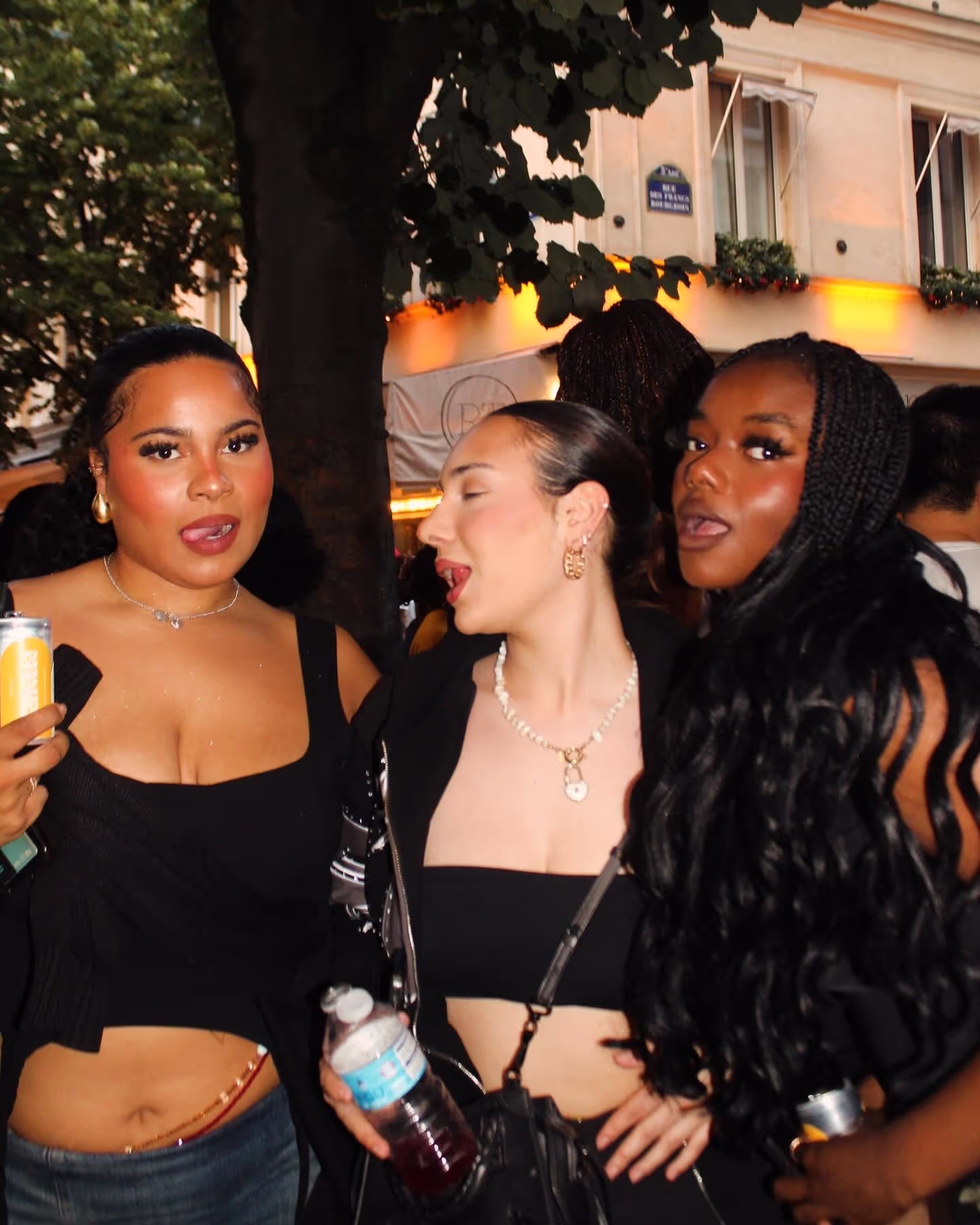 Three girlfriends having fun and posing at a Soirée's party at Paris Fashion Week 2024