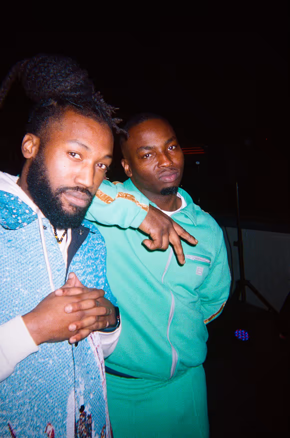 Two men posing at a rooftop party by Soirée in London, UK