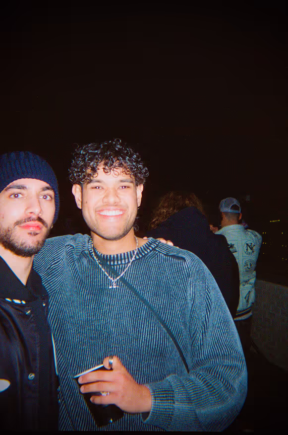 Two young men posing at a rooftop party by Soirée in London, UK