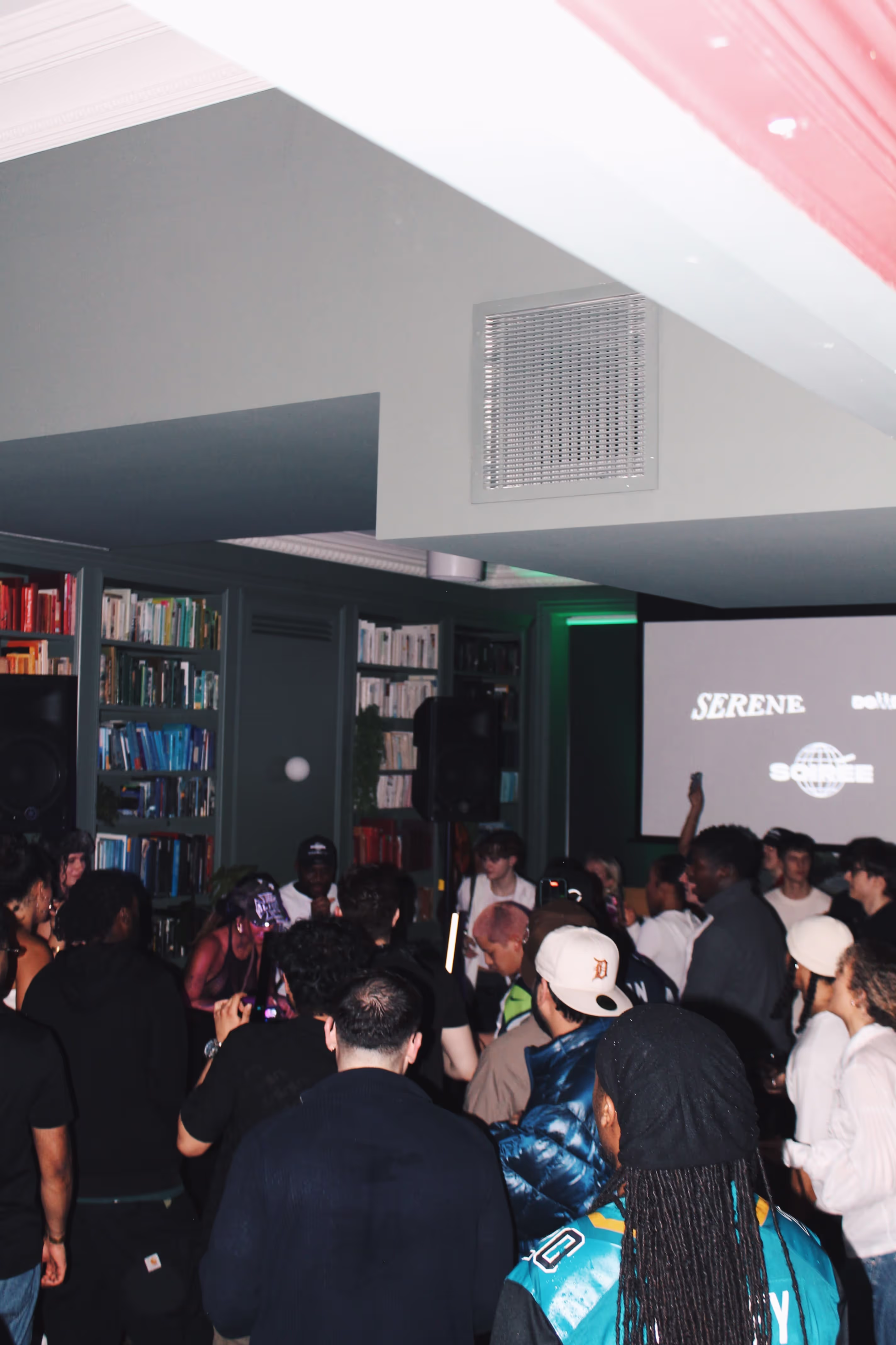 People dance at a collaboration party by Soirée, Doppelgängers, and Serene Collective at the library in London, UK