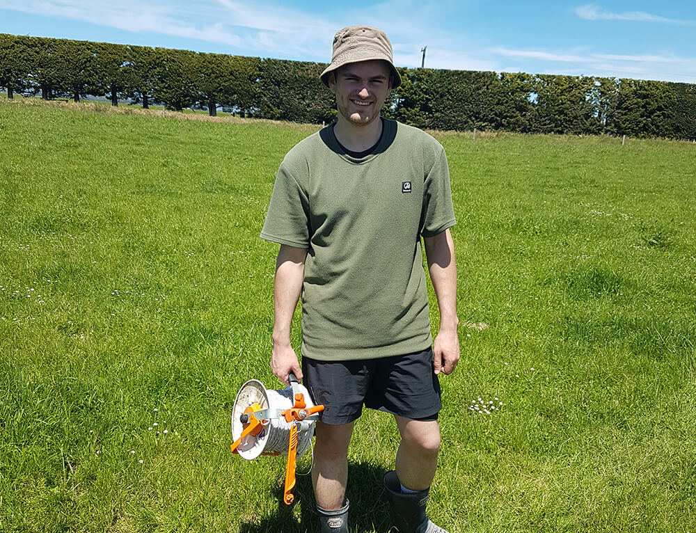 Thomas Ponter-Amor COO of Amua is on a farm