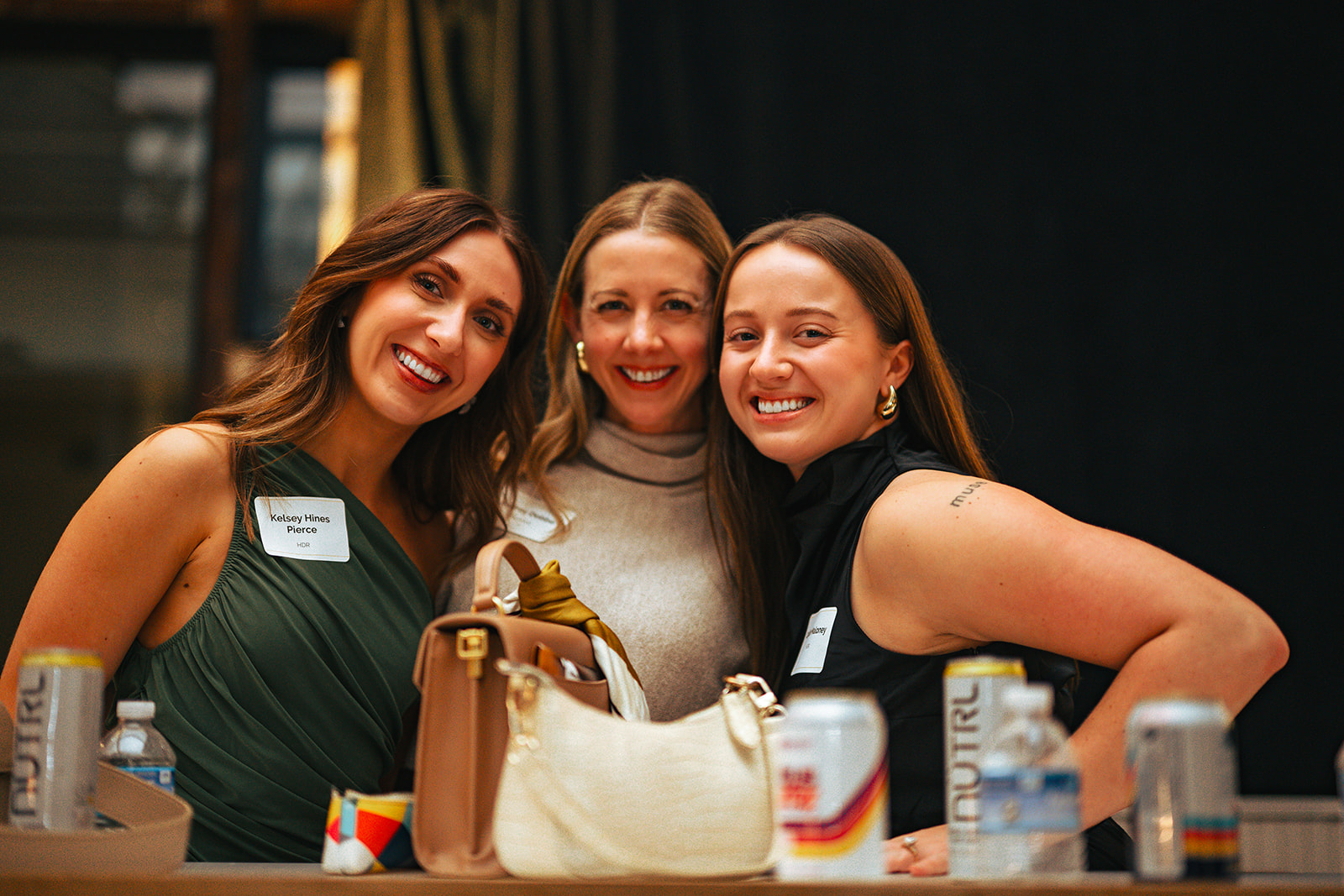Two volunteers in blue shirts smiling