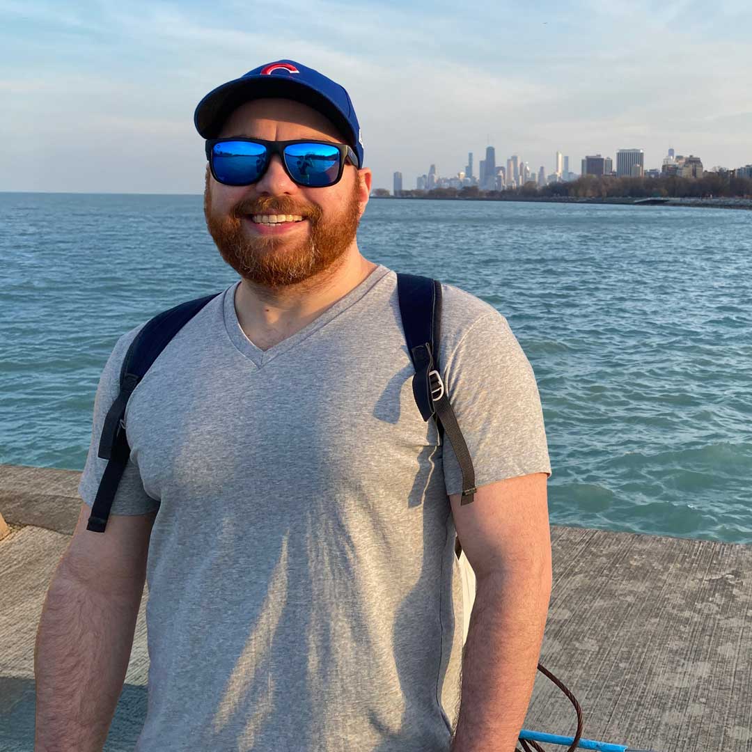 Matt Guerra standing near Spider-Man throwing peace signs