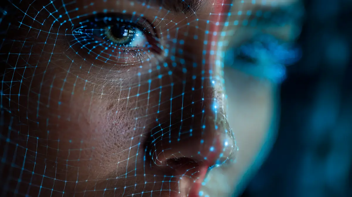 Close-up of human eye with digital wireframe overlay demonstrating facial recognition technology exploited in deepfake scams