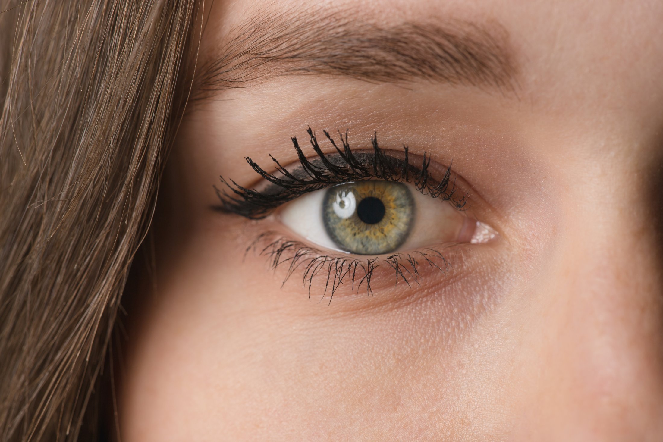Photo of a beautiful female, focusing on the right part of her face as well as the eyes