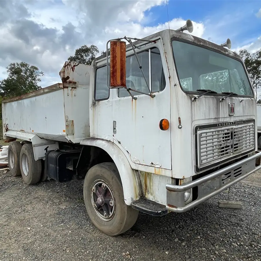 Logging truck driving along a road