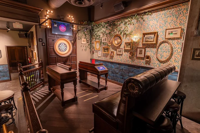 The dart board and lounge of Flight Club Denver.