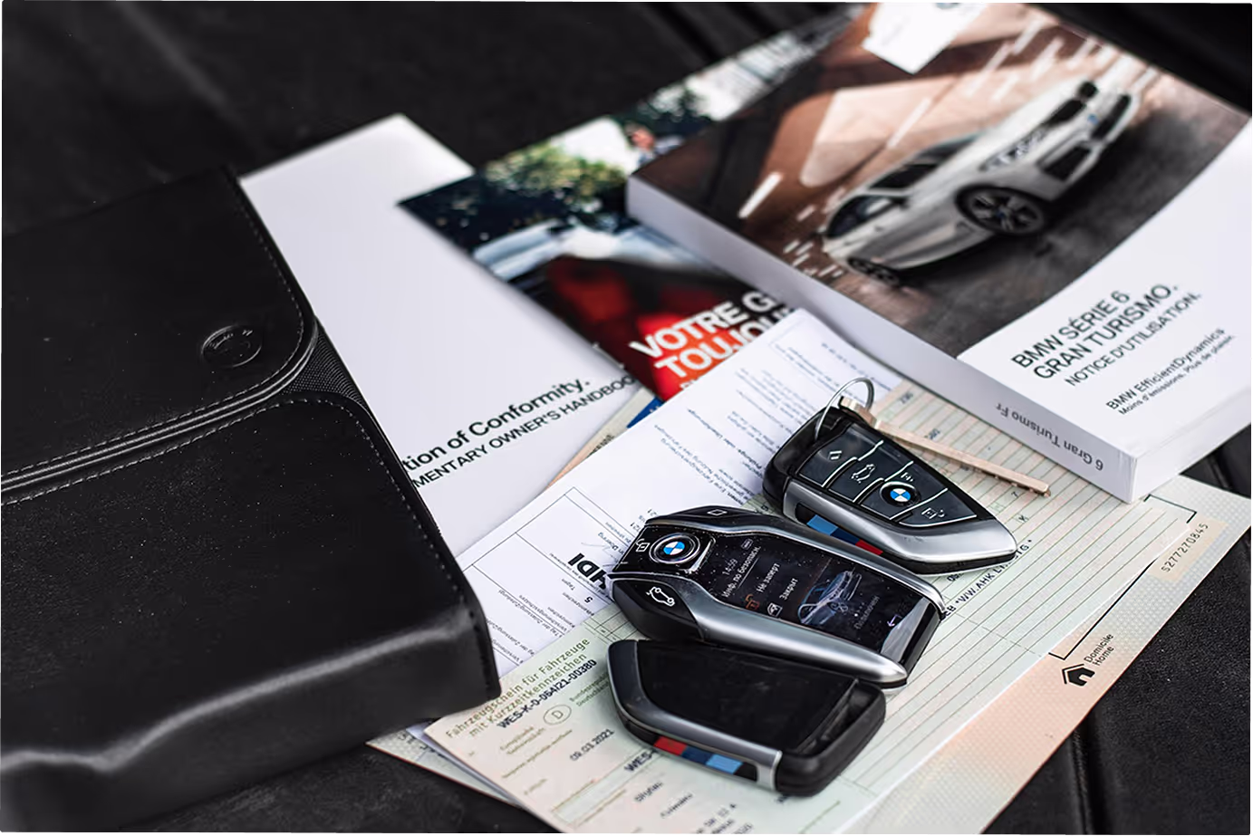 Car finance paperwork and car keys on a desk
