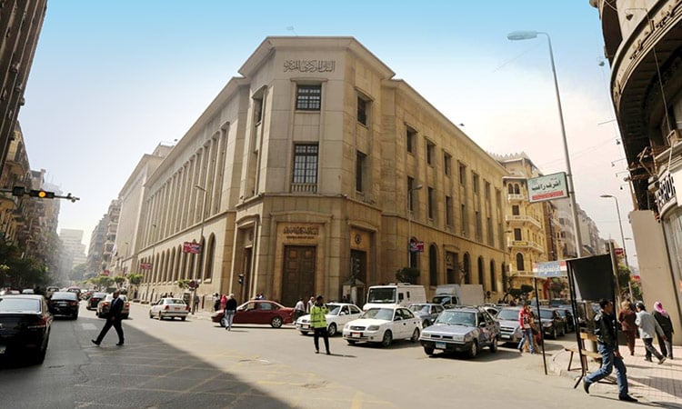 An Egyptian bank||an Egyptian 100 pound note||a phone, some bitcoins and a bitcoin wallet