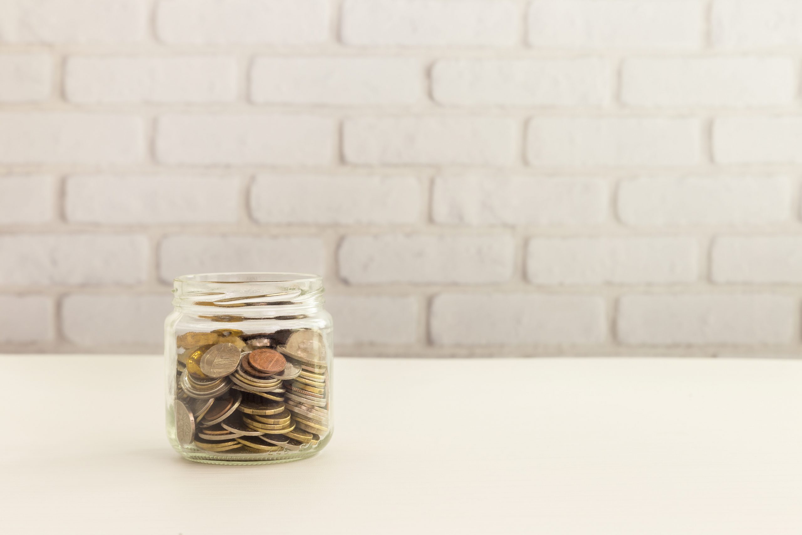 different coins in a jar
